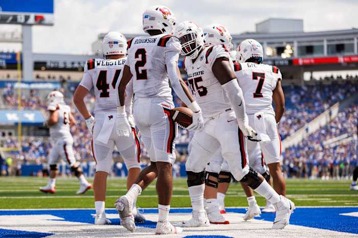Ball State Cardinals wide receiver Ty Robinson (2) and Ball State Cardinals offensive lineman Corey Stewart (75) celebrate a touchdown during the third quarter against the Kentucky Wildcats at Kroger Field. Mandatory Credit: Jordan Prather-USA TODAY Sports